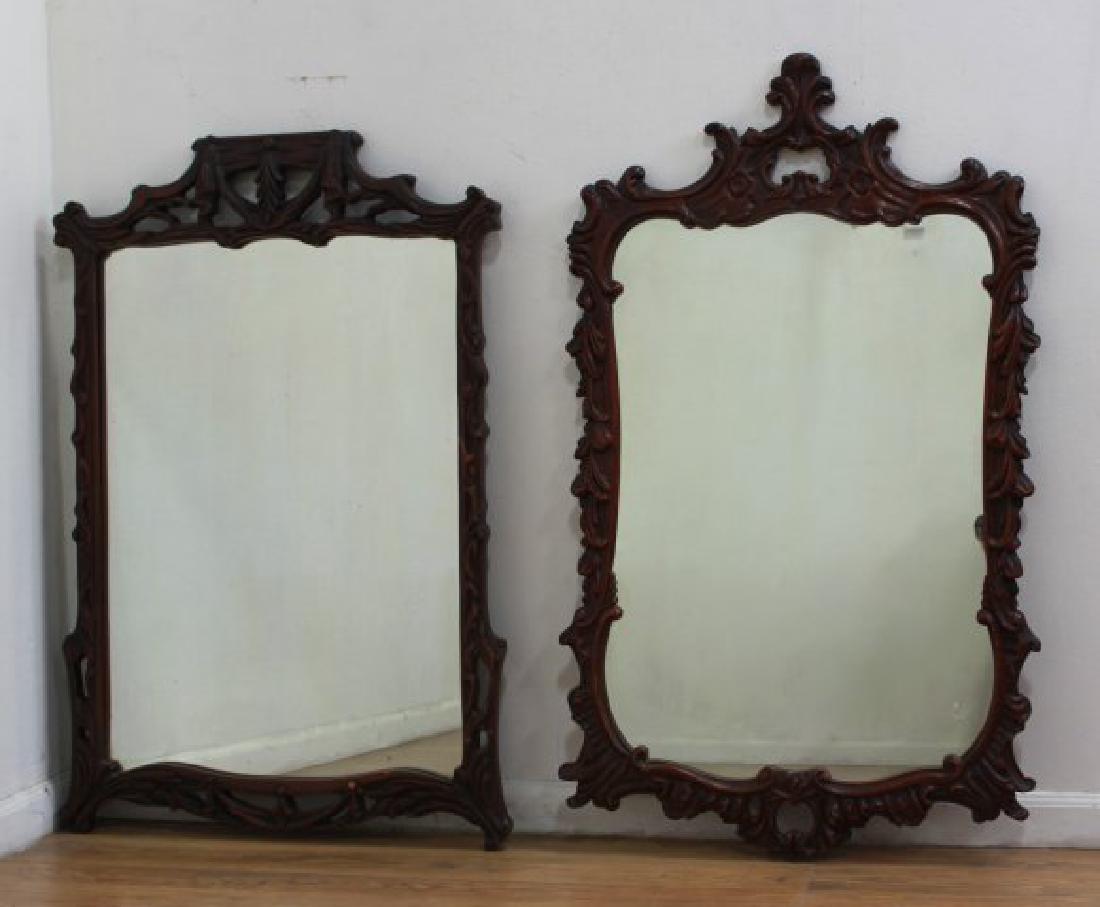 2 Carved Mahogany Mirrors: Circa 1930s. Approx. 46 1/2" x 27 1/2" and 44" x 28 1/2".