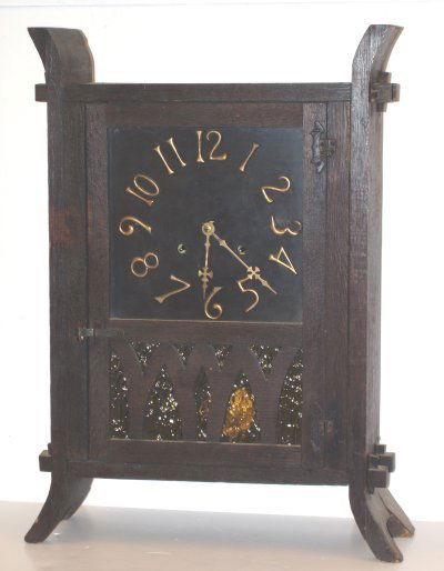 OLD MISSION CLOCK: CLOCK. OLD MISSION CLOCK. THE GLASS IN LOWER PORTION IS AMBER COLOR. WE HAVE THE CLOCK AND THE PENDULUM. IT IS HAS 2 KEYHOLES. THE MECHANISM IS COMPLETE. WE DO NOT GUARANTEE CLOCKS.