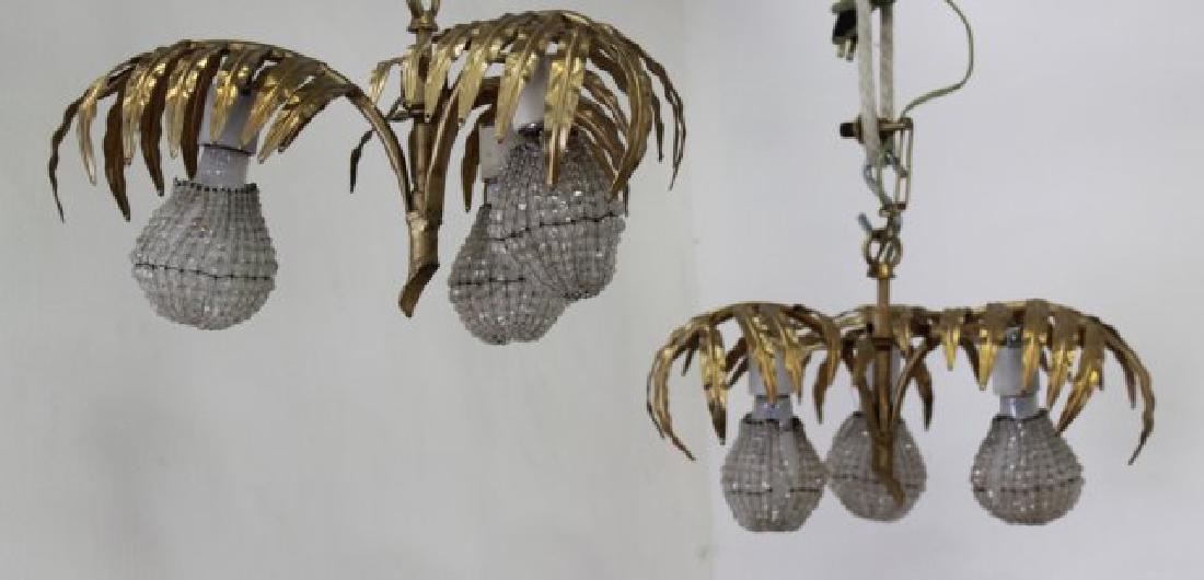 Pair 3-Light Gilt Metal Fern-Shaped Hall Lights: With beaded crystal shades. Approx. 9" H x 14" W.