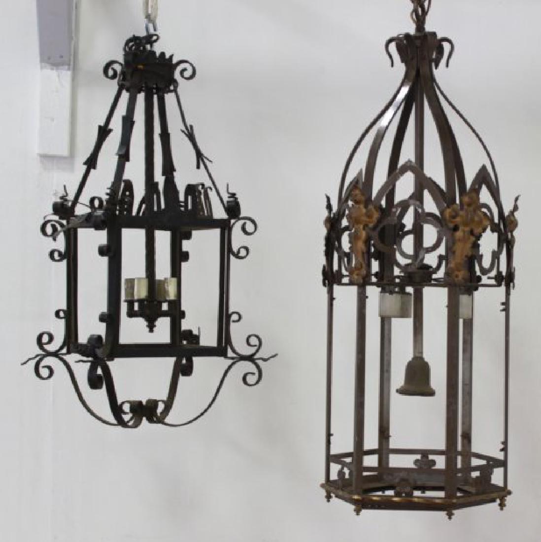2 English Wrought Iron Lanterns: Without glass panels. Largest approx. 36 1/2" H x 11" diameter.
