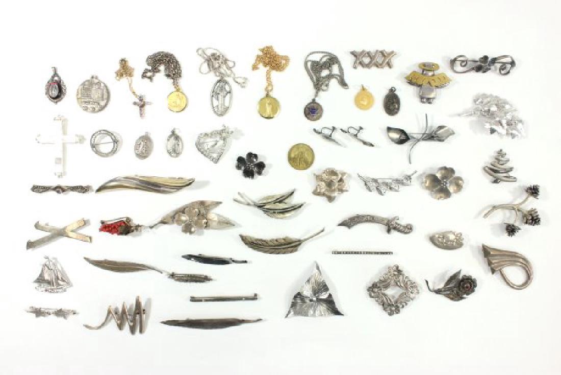2 Trays Vintage Sterling Silver & Costume Jewelry: Including coral, rhinestone, and religious pieces.