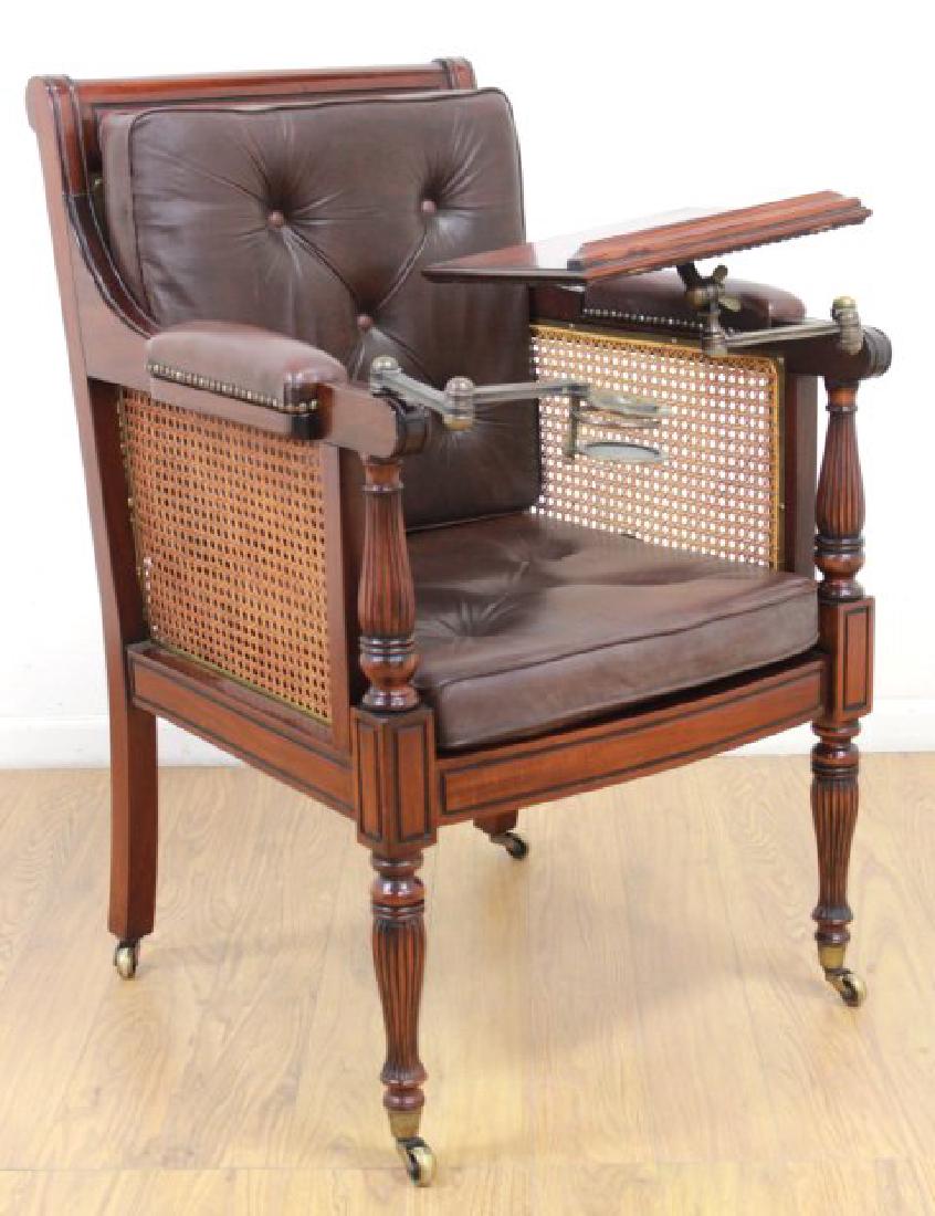 English Mahogany Writer's Chair: Cane back and side. Leather seat. With swivel attachments. Approx. 41 1/2" x 26" x 29" D.