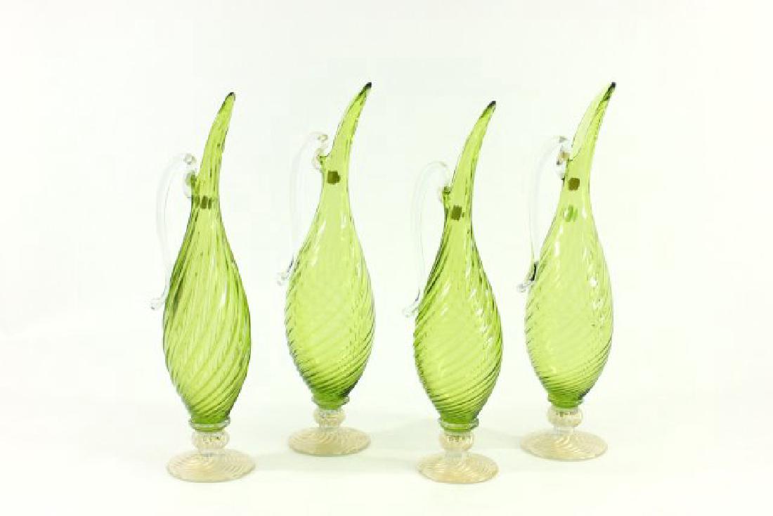 Lot 4 Mid-Century Italian Art Glass Ewers: Twisted design. Venetian glass balboa. Approx. 14" H.