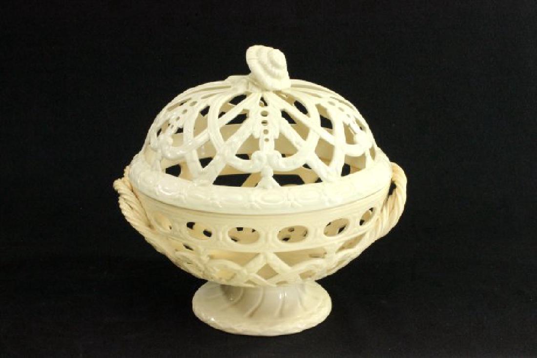 Wedgwood Creamware Reticulated Fruit Bowl: Approx. 9 1/2" H x 9 1/2" W.Some wear to bottom of bowl on edges and possible repair to floral finial at top.