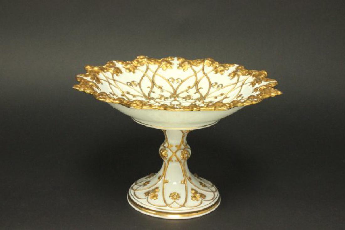 Meissen 2-Part Bowl on Pedestal: Heavily embossed gold encrusted leaf and flower motif. Approx. 7" H x 11" W.