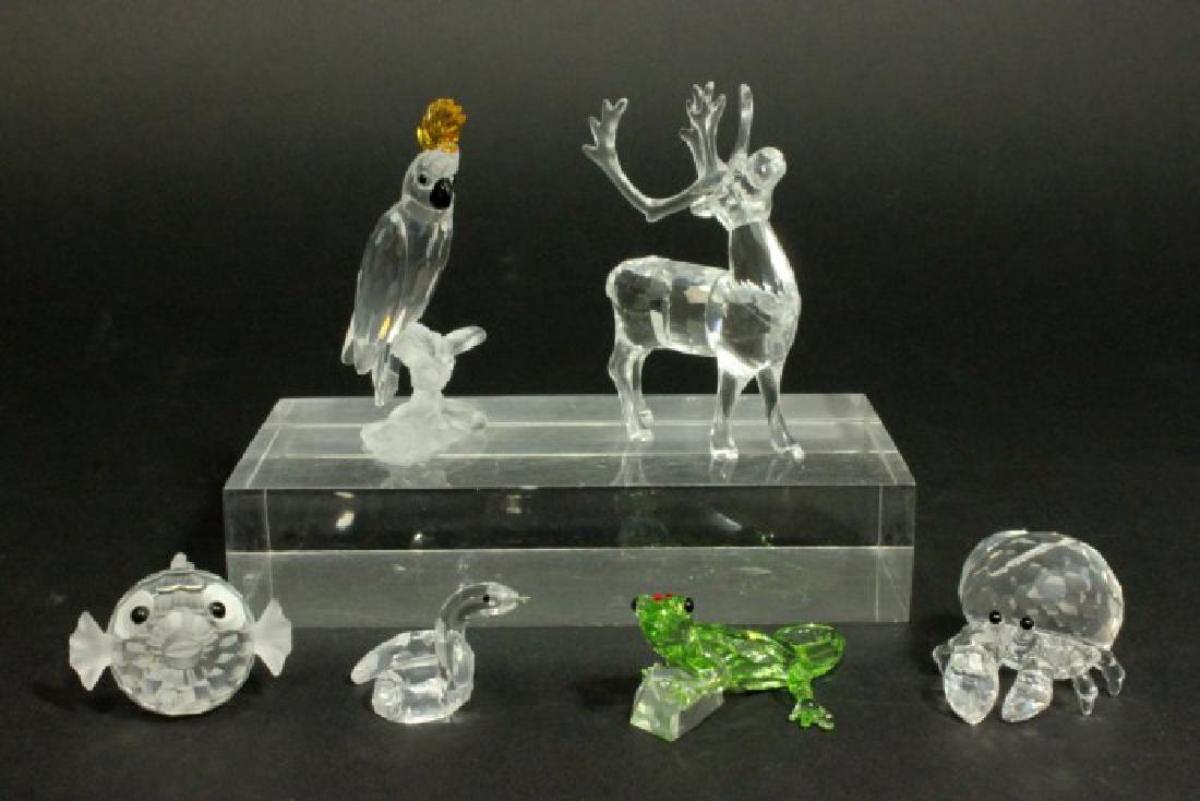 Swarovski Collection: Including cockatoo, zodiac snake, reindeer, hermit crab, blowfish, and gecko.
