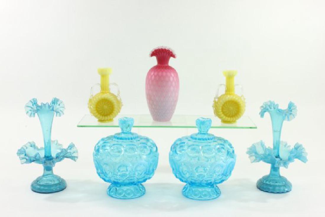 Group Lot Victorian Glass Pieces: Including 2 blue 2-part epergnes, pair blue glass covered jars, pair yellow vases with handles, and cranberry glass vase. Tallest approx. 8 1/2" H - cased glass satin. 7 pieces in total. From the esta