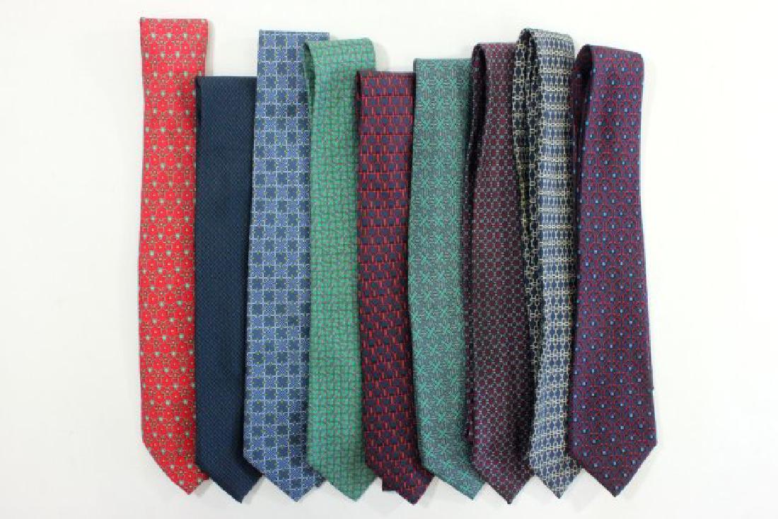 9 Hermès Paris Geometric & Chain Pattern Silk Ties: Including 903 HA - blue chain link on wine background; 967 SA - white chain link on navy background; 878 PA - blue, navy, & wine houndstooth pattern; 907 HA - red & blue geometric cup pattern; 7319 EA