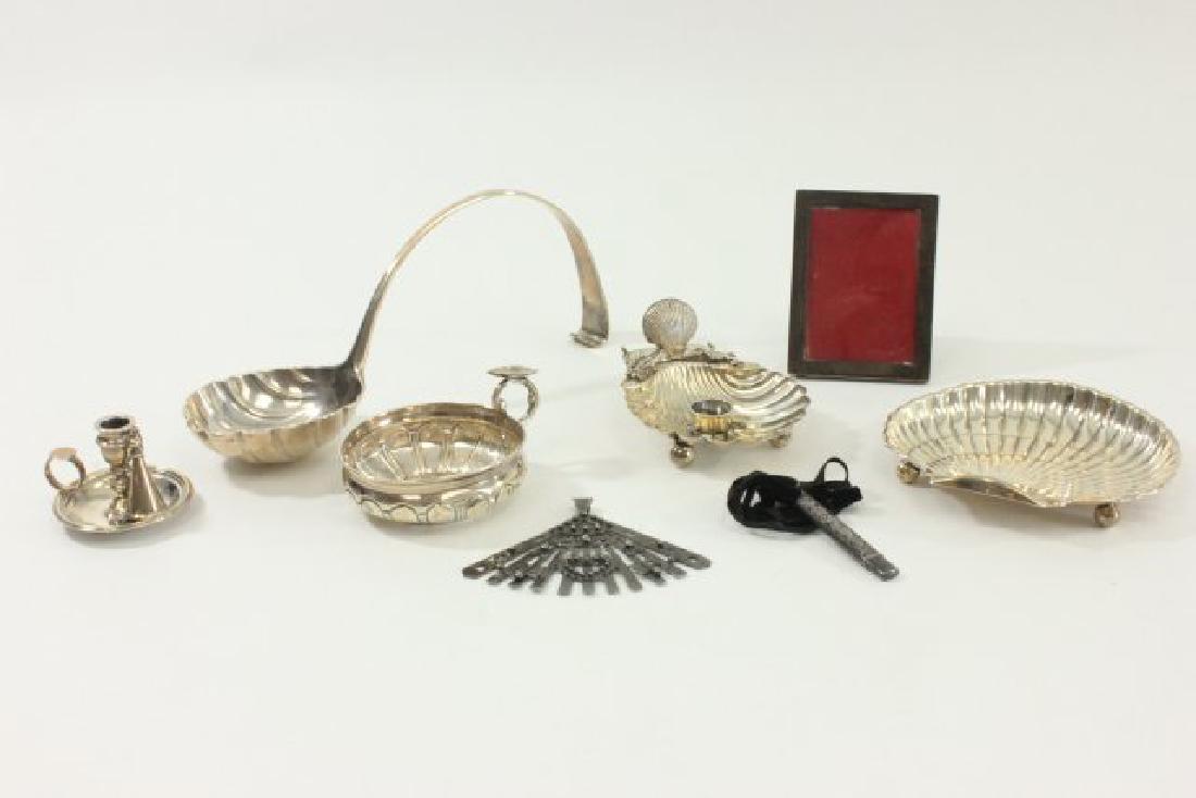 Lot of Sterling Silver Items: Including English sterling silver shell shape candleholder; English chamber stick with snuffer; Gorham sterling silver shell dish, approx. 6" W; sterling silver picture frame; sterling silver pencil; 
