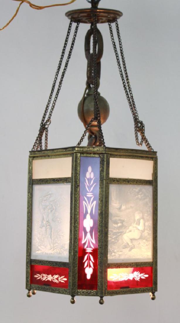 4-Panel Lithopane Ceiling Fixture: With ruby cut-to-clear inserts. Approx. 21" H with chain x 7 1/2" W. From an Englewood Cliffs, NJ contents. 1 as is.