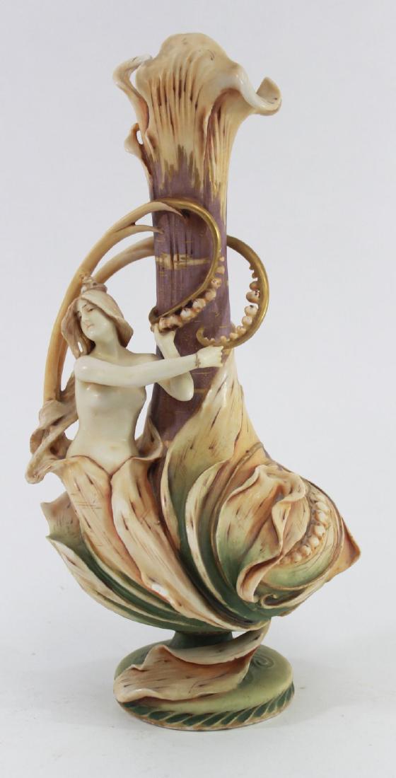 Teplitz Figural Pottery Vase: Decorated with flowers and semi-nude woman. Approx. 14" H. (7065) Some flakes.