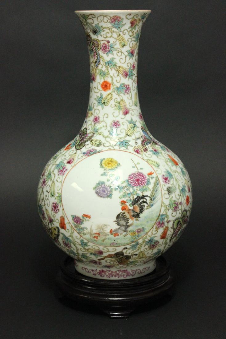 Chinese Porcelain Vase with 3-Panel Design: Floral motif. Approx. 16" H without wood stand.