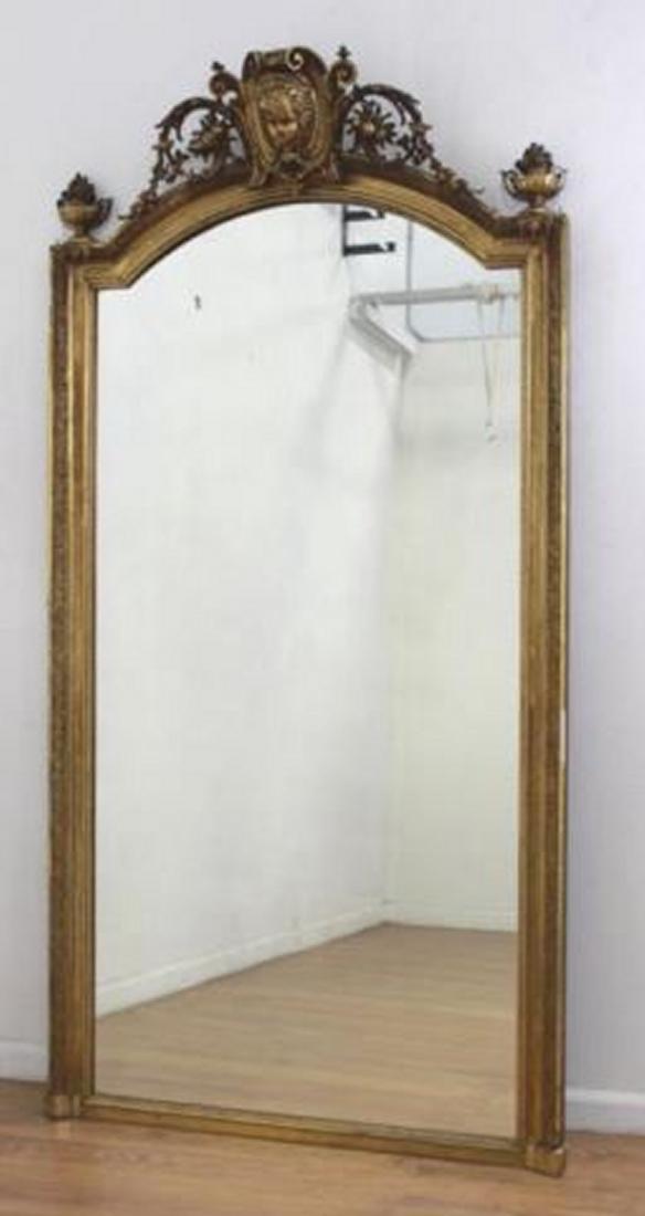 19th Century French Beveled Glass Gold Leaf Mirror: Heavily carved. Approx. 84" H x 42" W.