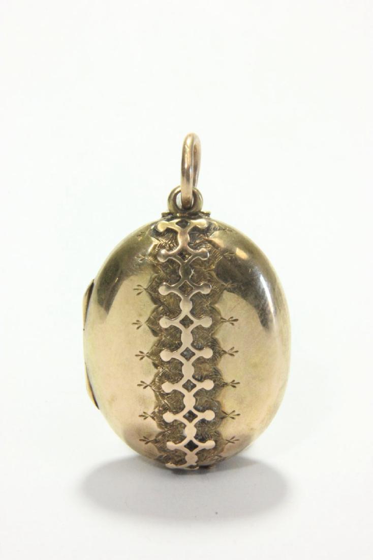 Victorian Gold Locket with Picture & Hair: Approx. 1" H. Approx. 5.3 dwt (8.1 grams). (7079)