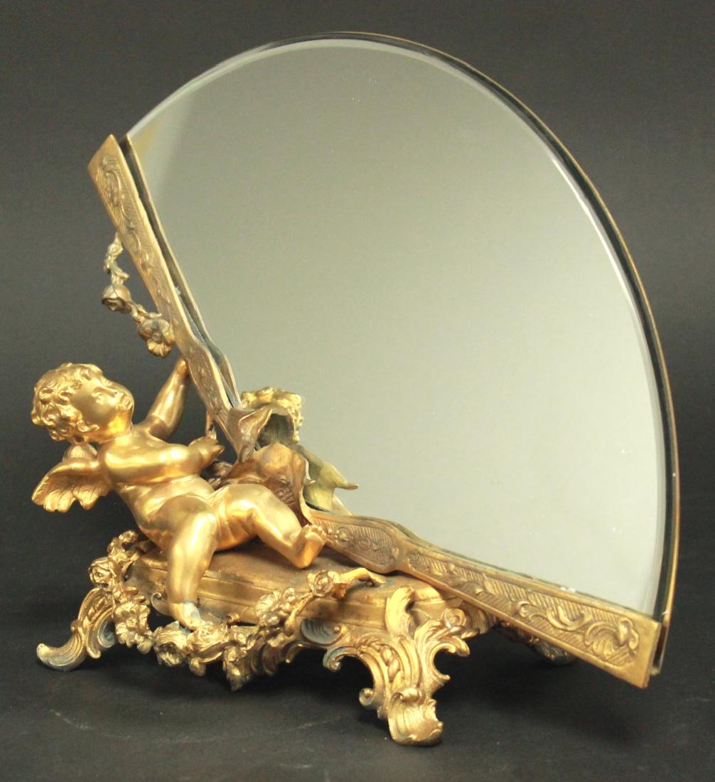 Fan-Shape Table Mirror: With cupid and flowers. Approx. 10" H x 13" W. (44)