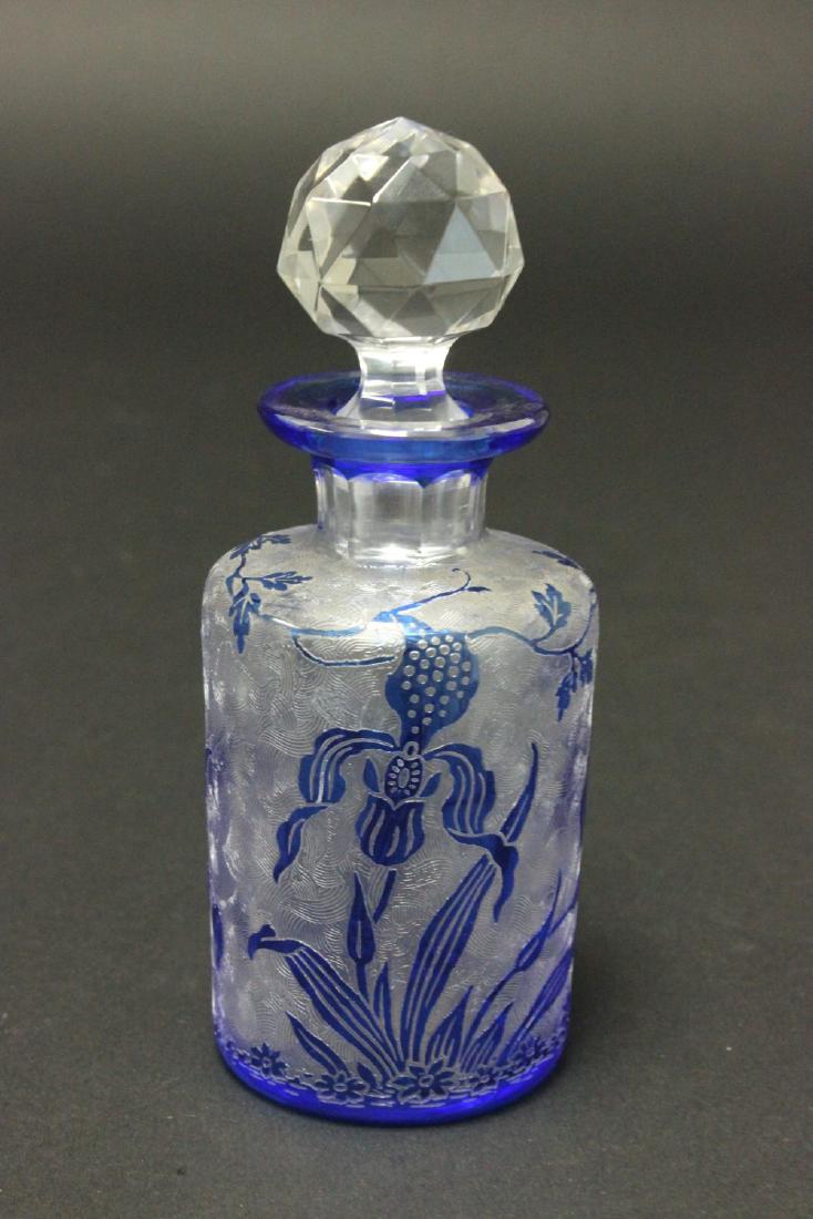 Etched Blue Glass Baccarat Perfume Bottle: Decorated with flowers. Unsigned. Approx. 5 1/2" H with stopper. From the personal collection of Jeffrey Zimmerman.