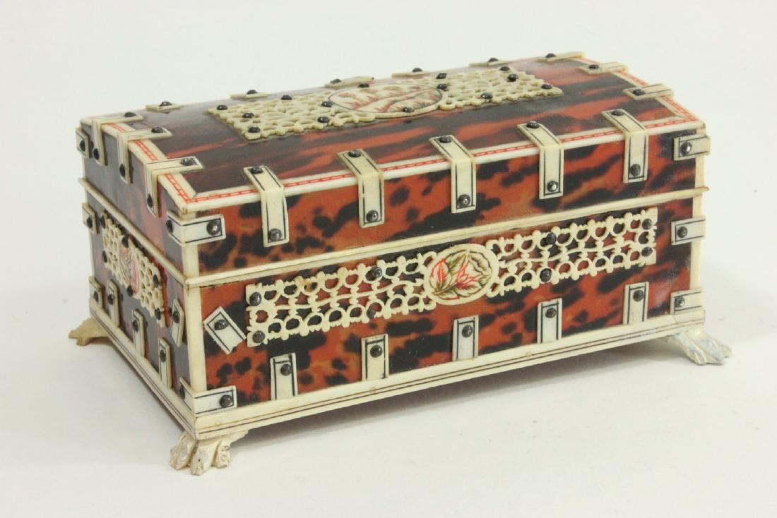 Amboyna Wood & Bone Casket: Bone straps and decoration. Approx. 2 1/2" x 5 1/2" x 3". From the personal collection of Jeffrey Zimmerman. 1 claw foot replaced.