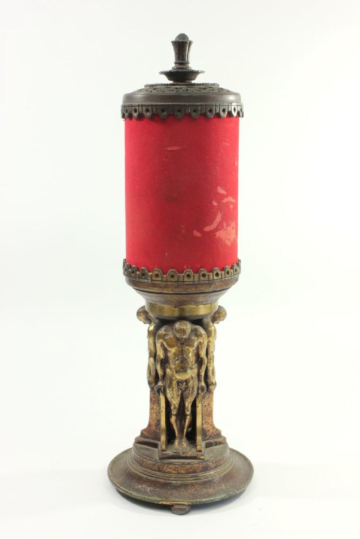 Oscar Bach Art Deco Bronze Lamp: Circa 1930s. Oscar B. Bach Studios, New York. Stamped on bottom. 4 standing nude men. Red velvet shade. Approx. 23" H. From the personal collection of Jeffrey Zimmerman.