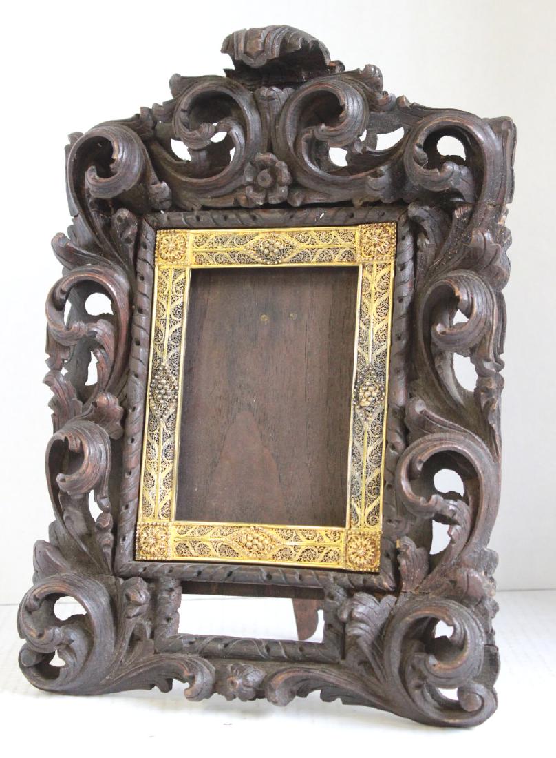 19th Century Carved Wood Baroque Frame: Scroll design with gilt silver interior frame. Moorish style. Probably Portuguese. With easel stand. Approx. 13" H x 9 1/2" W. From a Bogota, NJ contents.
