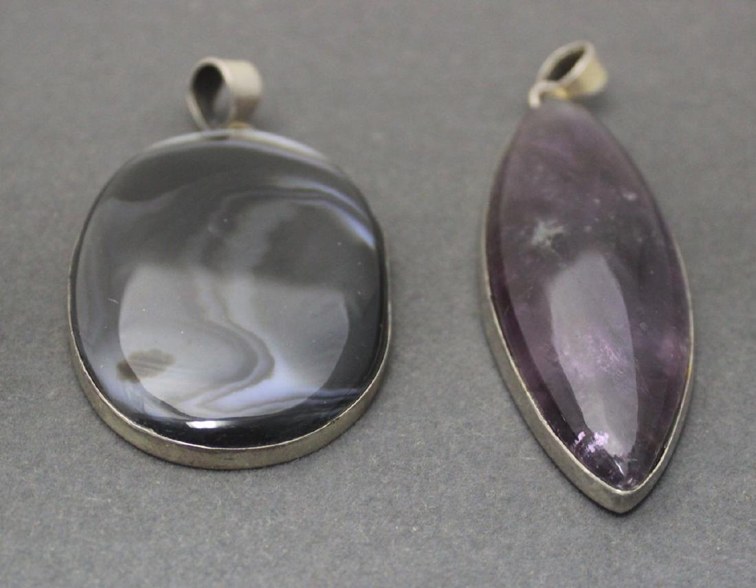 2 Large Sterling Silver Framed Pendants: Oval obsidian approx. 2 3/4" x 1 7/8"; and marquis amethyst approx. 3 1/2" H x 1 1/8".