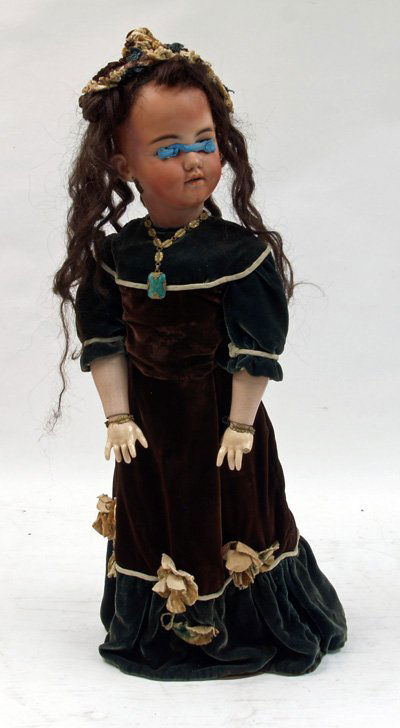 S & H jointed Santa lady doll in velvet dress: Bisque head, Germany. Approx. 28" H. Ca. 1850 costume. Glass eyes out but in the head. Missing thumb and pinky on one hand 734 1249. Face has not been re-painted. No damage, chips, cracks or hairlines