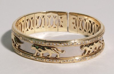 Cartier style gold band bracelet of panther