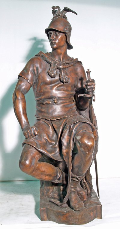Figure of bronze Roman seated with sword