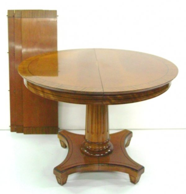 Round banded dining room table: With 3-12" W leaves. Approx. 29.5" H x 42" Diam., banding Approx. 2.75" W