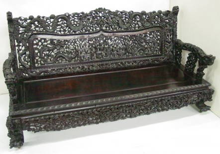 19th c. Chinese carved teakwood loveseat: Figural. Approx. 40" H x 79" W x 28" D