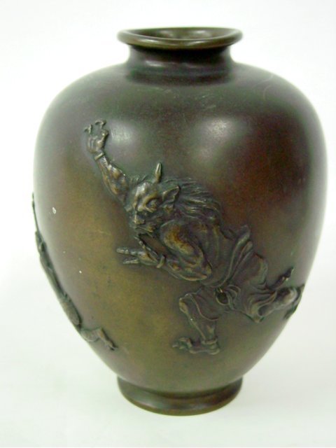 19th c. Chinese bronze vase artist signed: Depicting "Monster Chasing Animal". Approx. 7.25" H
