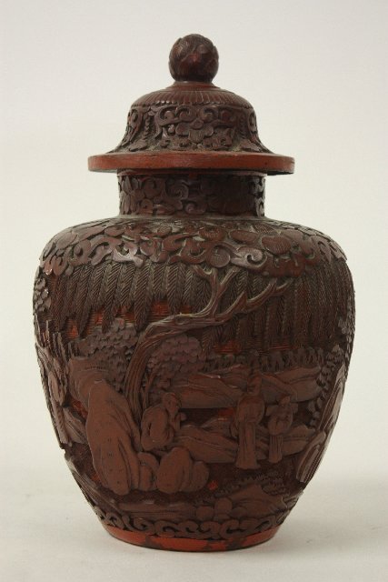 Chinese antique cinnabar lacquer covered jar: Well carved with figures in a landscape; damage to lid interior; Height: ~11.5"; Width: ~7"