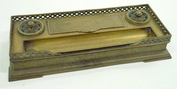 19th c. bronze bouble inkwell stamp holder: With etched flame & torch design. With pen rest. Approx. 9" W x 3.75" D x 1.75" H