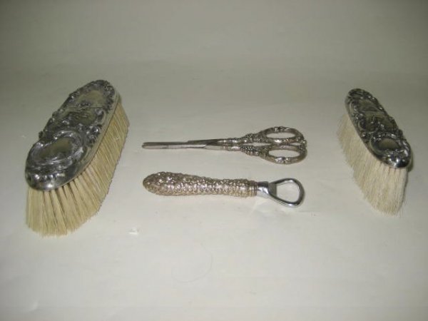 Group lot asssorted sterling silver pieces: Includes:2 matching sterling silver repousse clothes brushes, 1-sterling silver (Steif) handle bottle opener & Victorian sterling silver grape shear. 4 pcs.