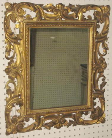 Italian giltwood hand carved mirror: Scroll design. Approx. 2' x 2.5'