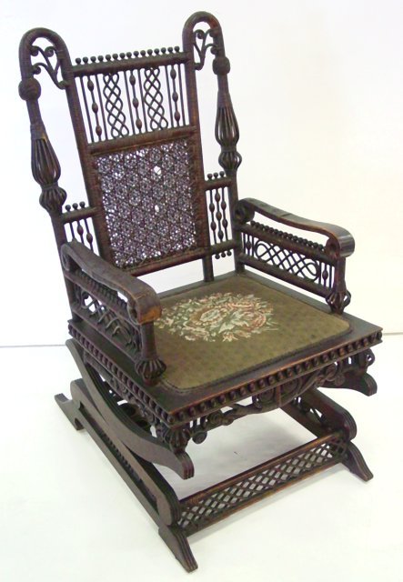 Heywood Bros. rattan platform rocker: Losses of wrapping on one arm, two small holes on back.