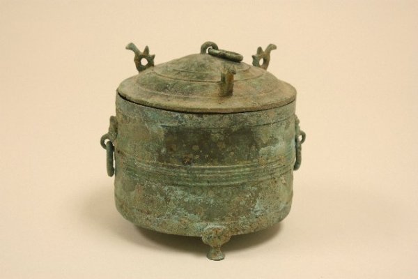 Antiquity bronze footed covered round pot: With birds atop, ring on top & sides. Approx. 5" H x 6" D. From the estate of Charles Mogensen
