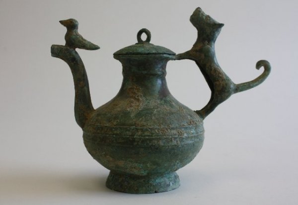 Antiquity bronze vessel with lid: With "dog" handle & "birds" spout. Approx. 9" H. From the estate of Charles Mogensen