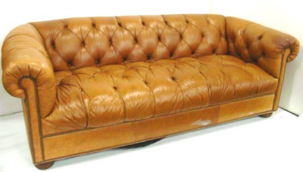 Tuxedo style leather Chesterfield sofa: Button tufted. Approx. 85" W 30" H x 35" D