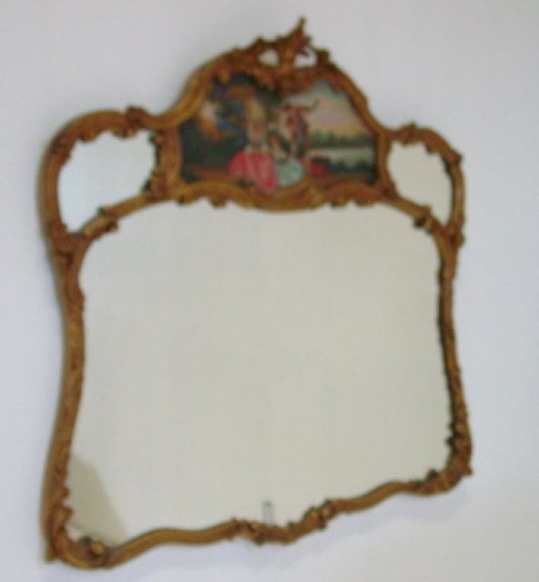 Gilt wood carved mirror ca. 1920-30's: With French handpainted "Courting Scene" on top. Approx. 44" H x 43" W