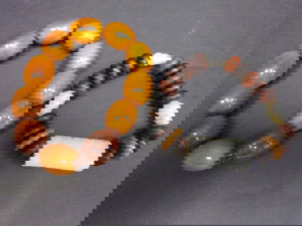 2 beaded bracelets: Approx. 7-8" 1-Rhino horn & 1 jade beads