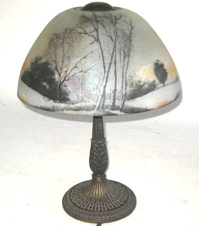 Reverse painted glass shade on metal base: Early 20th c. American, possibly Jefferson, Pairpoint or Handel. "Autumn Scene with Trees". Good condition. From a New Rochelle NY Estate. Approx. 18" H, Shade approx. 6" H x 12" Diam.