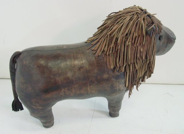Leather lamb footstool: Approx. 32" L x 22" H. Contents of a Park Ave. apartment.
