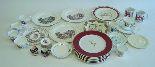 Group lot of assorted porcelains: Includes: cups, saucers, plates relating to the Coronation of the King & Queen of England, New York plate, Brooklyn Bridge plate, 2 small Royal Doulton mug & 11 porcelain butter pots. Contents of the