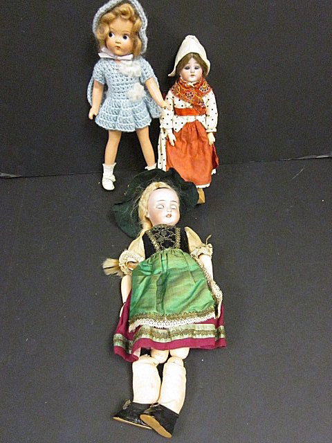 2 old bisque dolls, 1 composition doll: Bisque dolls in native dress. German doll is approx. 9.5" h, need to be re-strung. Dutch old composition doll in crocheted dress & hat approx. 11" h. Contents of the Brooklyn Heights Montague Terrace 