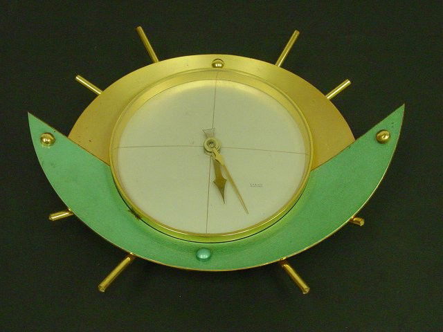 Modern bronze abstract wall clock Carina: Mid 50's. Electric. Approx. 10" x 10.5"