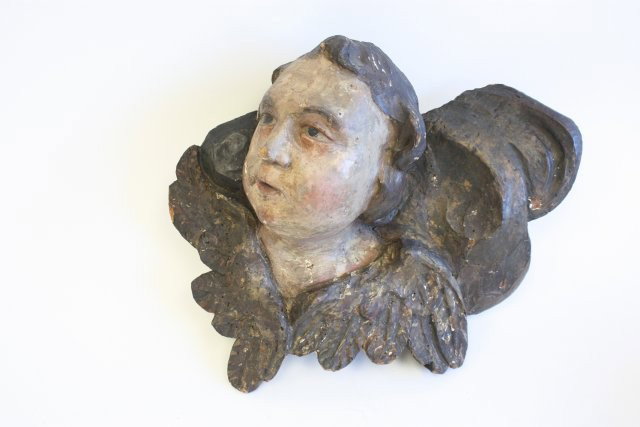 Mid 17th c. polychromed carved "Cupid" head: Approx. 14" W x 12" H. From the estate of Carl Freed of K. Gluck Selig Antiques, mid-town Manhattan dealer.