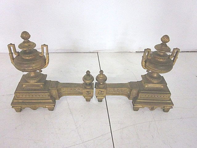 Pair bronze urn shaped chenets with center fende: Approx. 16" x 16". From the estate of Carl Freed of K. Gluck Selig Antiques, mid-town Manhattan dealer.