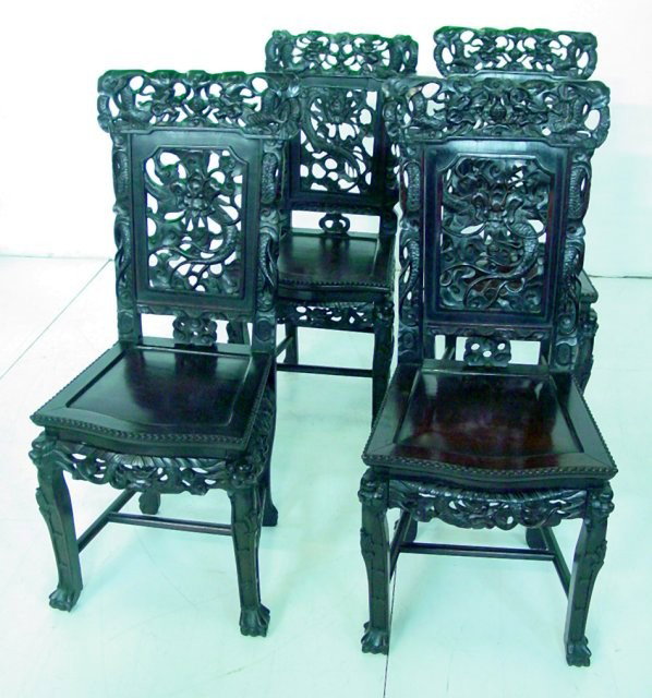Set of 4 19th c. Chinese rosewood side chairs: Carved depicting "Animals & Dragons". Approx. 40" H x 17.5" W.