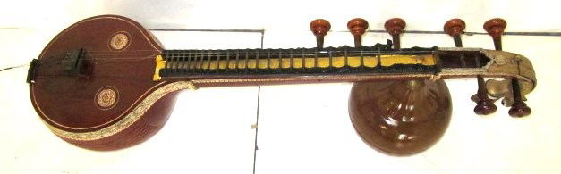 Sitar with carved Dragon head: Cracks in wood, missing peg.