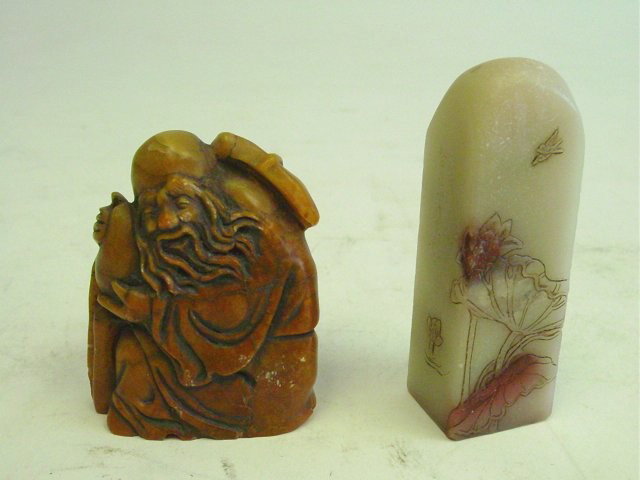 Two pieces soapstone: 1-2.75" x 2" Chinese figure of "Old Man". 1-3.25" H Stamp with etched design of "Flower".